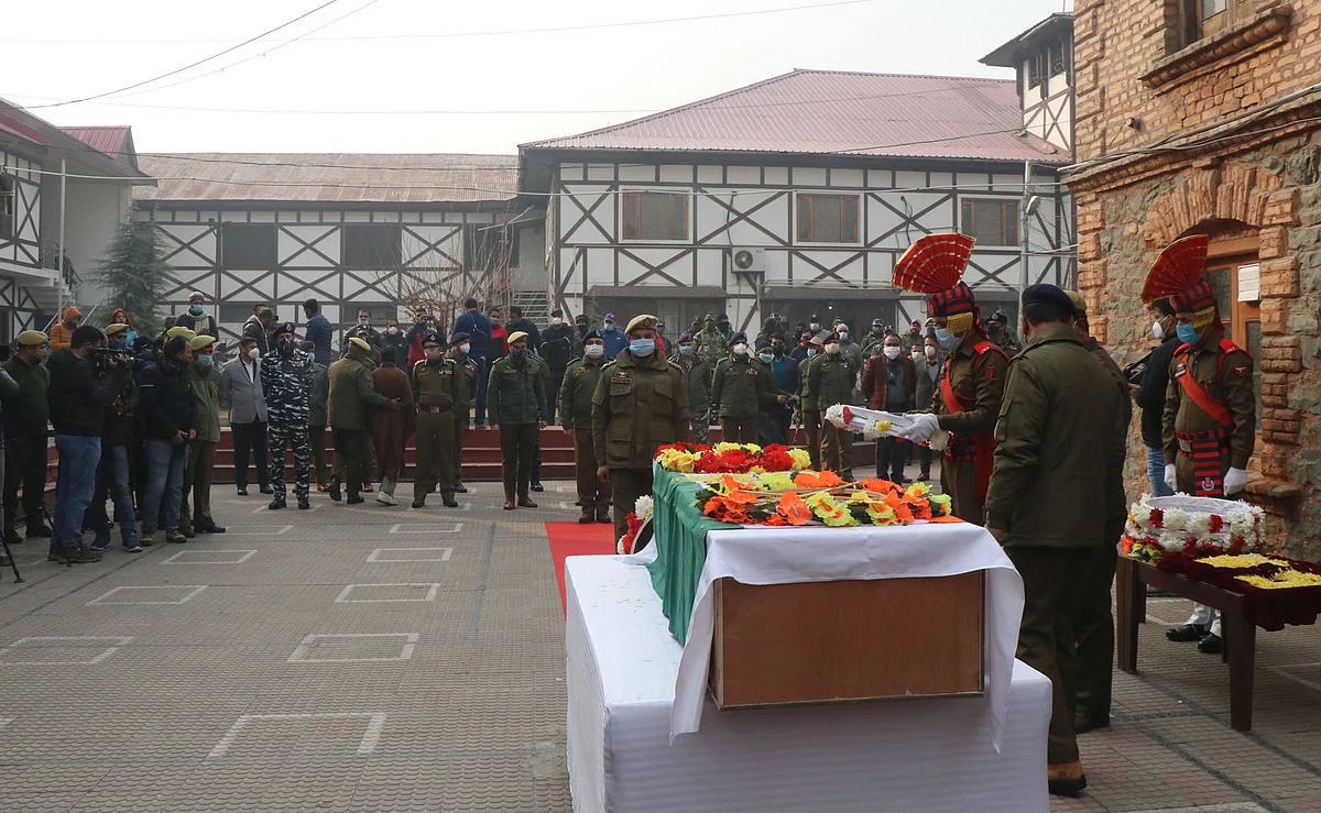 Wreath laying ceremony of slain constable Rameez Ahmad Baba killed along with two of his fellow cops in a militant attack yesterday, at DPL Srinagar on Tuesday December 14, 2021.