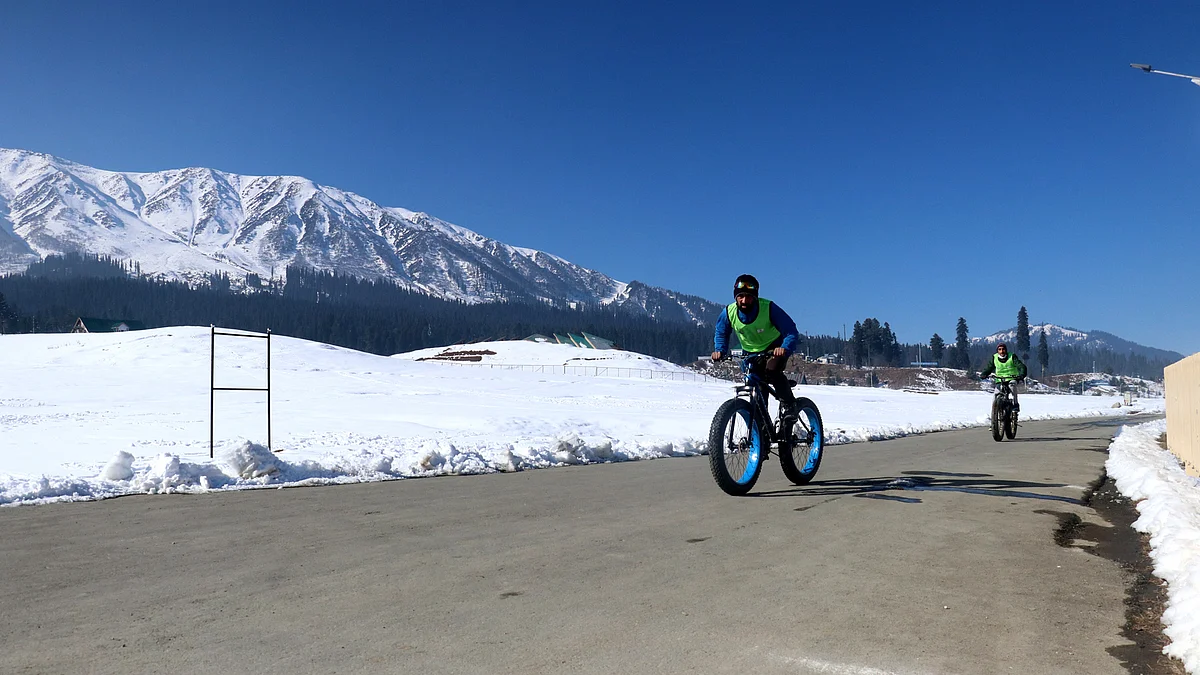 Youth during a snow cycling competition on International Mountain Day at famous destination Gulmarg in north Kashmir's Baramulla district on Saturday December 11, 2021.
