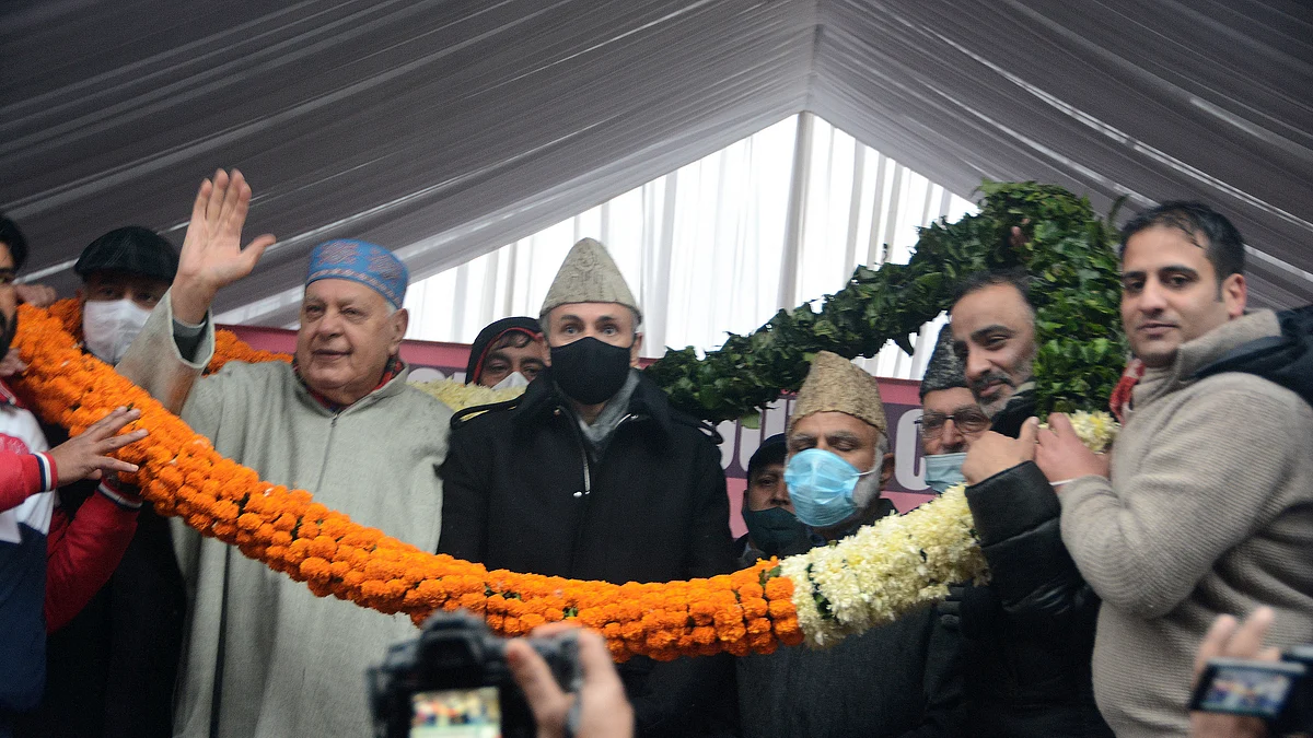 National Conference President Farooq Abdullah, vice president Omar Abdullah and senior NC leader Ali Mohammad Sagar being garlanded at a party convention in Srinagar on Sunday December 5, 2021.