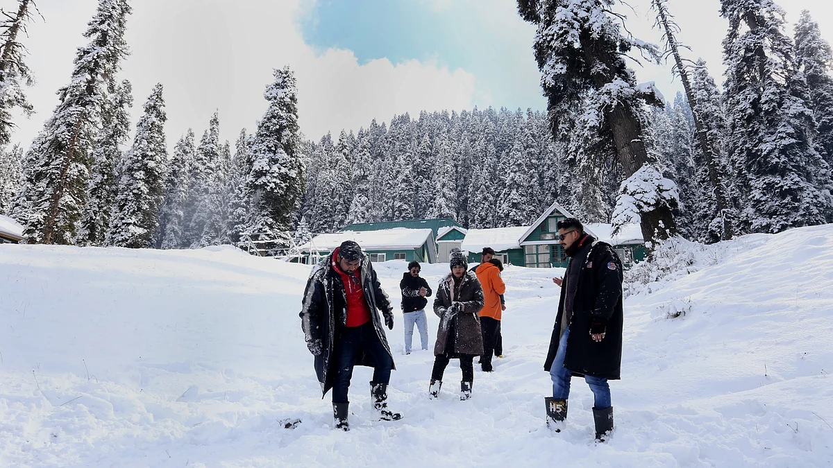Tourists enjoying fresh snowfall at famous tourist destination Gulmarg in north Kashmir's Baramulla district on Monday December 6, 2021.