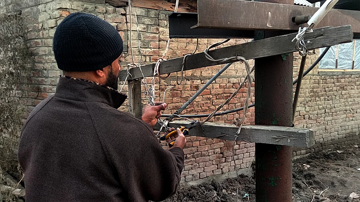 Local trying his hand at repairing supply transformer as PDD employees have called strike against government's decision to privatize the electricity in the region.