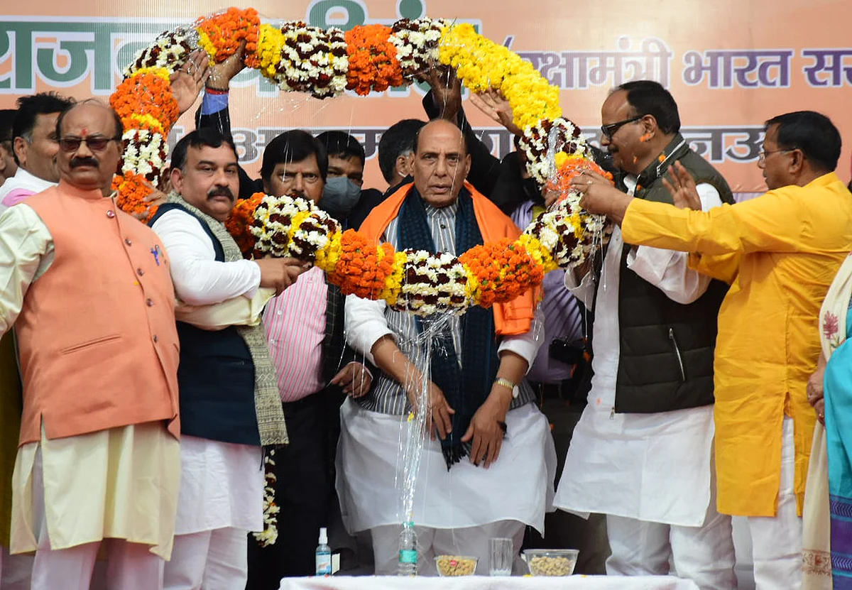 Defence Minister Rajnath Singh being garlanded during a public meeting in support of Bharatiya Janata Party (BJP) candidate from Lucknow Cantt assembly seat Brajesh Pathak, at Awadh Crossing, in Lucknow on Friday.