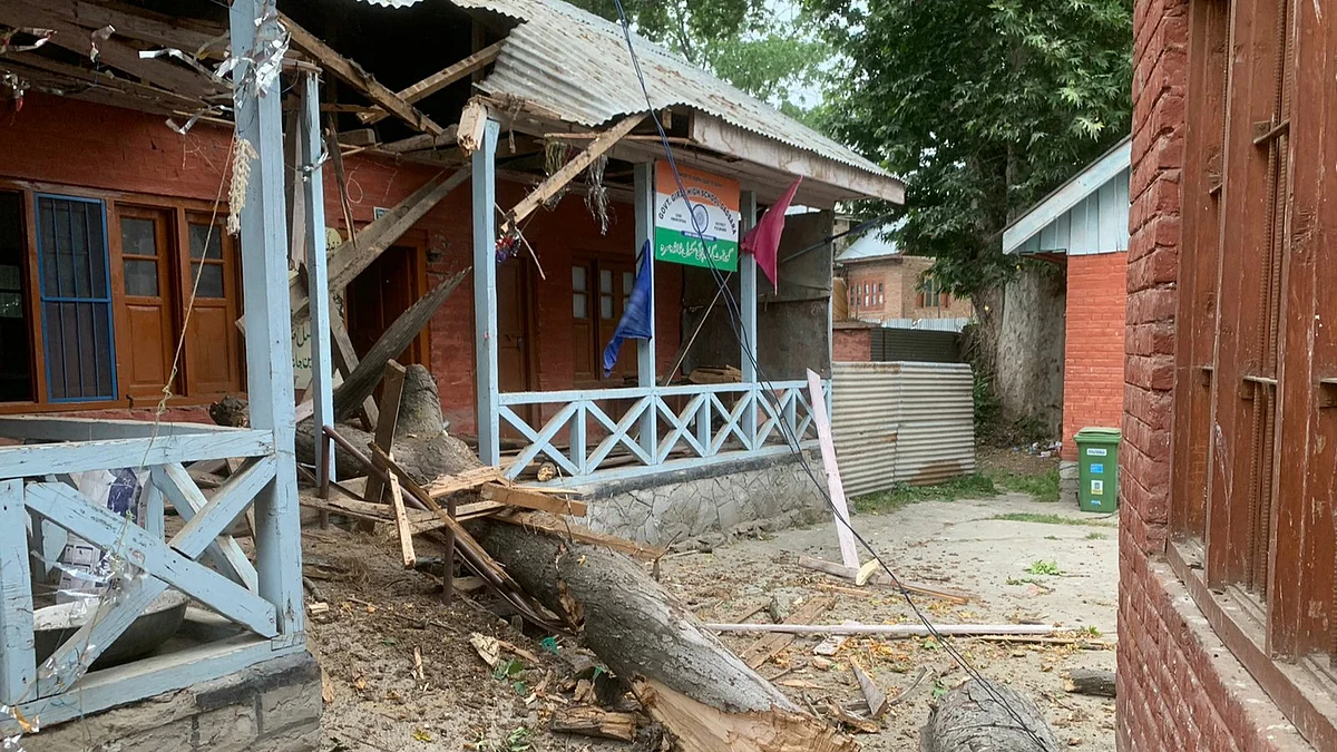 The building of Government Girls High School Dadsara Tral south Kashmir's Pulwama district was damaged after a branch of a chinar tree fell on it due to gusty winds, reports said.
