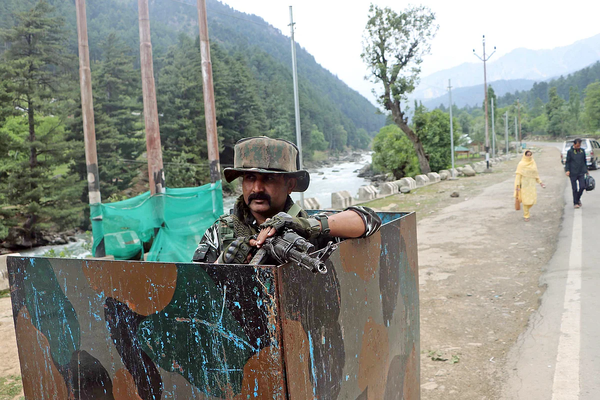 Army man stand guard at a checkpoint as part of arrangements ahead of the Amarnath Yatra, in Pahalgam on Friday, 10 June 2022.