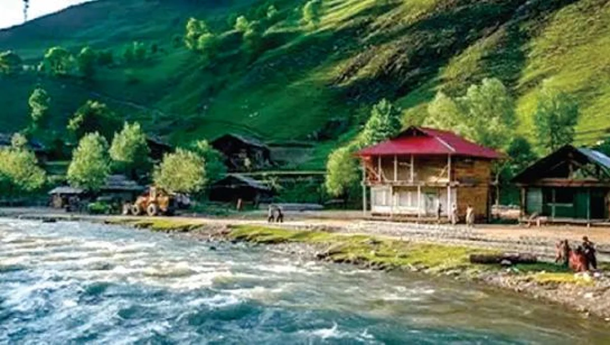 "Guarded by coiled concertina-covered bunkers, visitors prove their identities to men-in-fatigues. Driving on this bumpy track is no bon voyage but a back-breaking journey."