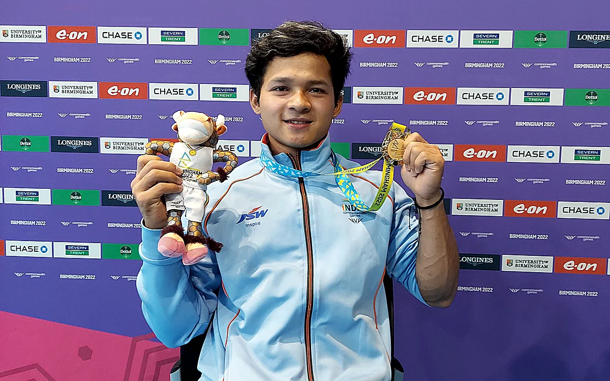 Weightlifter Jeremy Lalrinnunga poses for a picture while showing his Gold medal which he won in Men's 67kg finals weight category with a total of 300kg at the Commonwealth Games 2022, in Birmingham on Sunday.