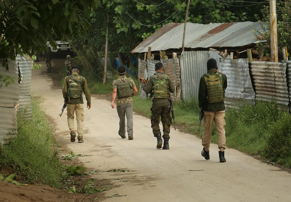 Policemen at the site of gunfight in Baramulla