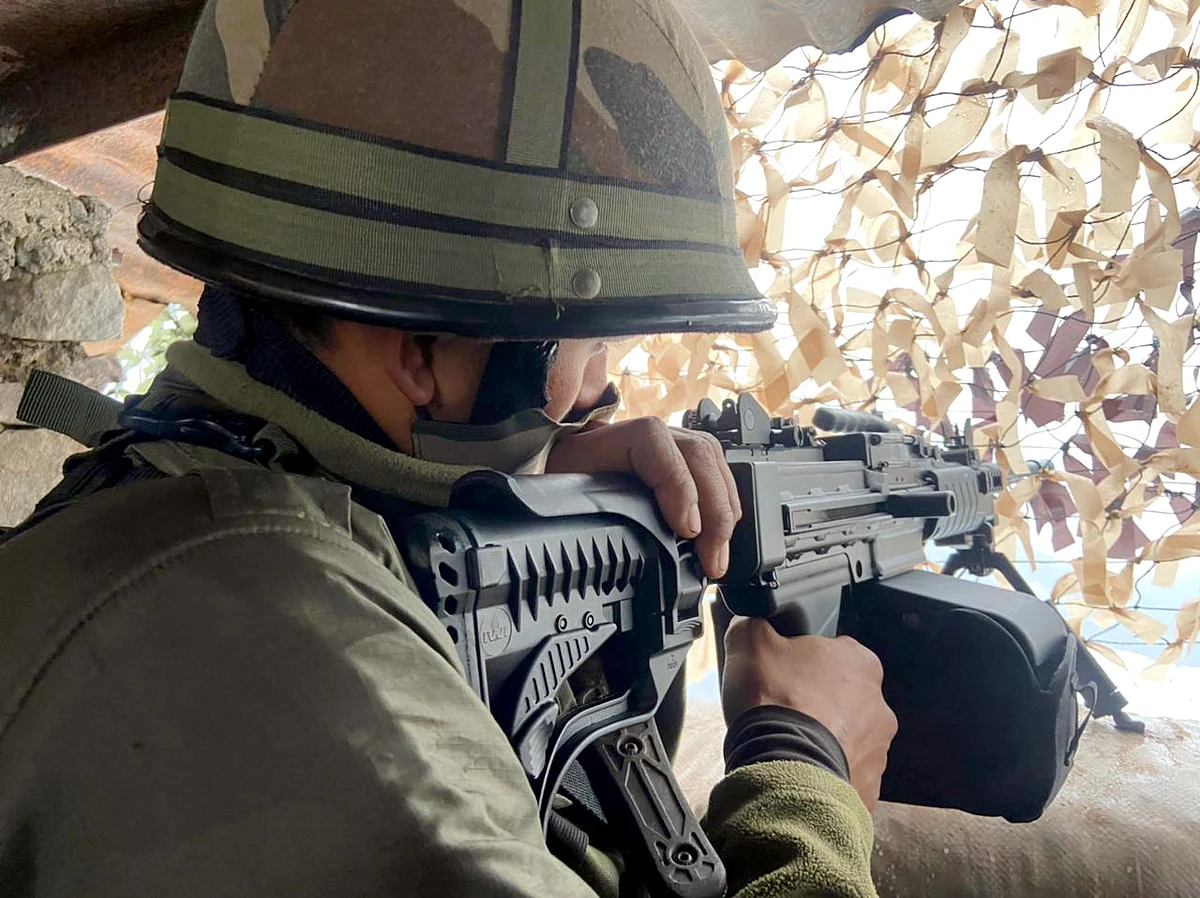 An Army personnel stands guard at the Line of Control (LoC) near Poonch.