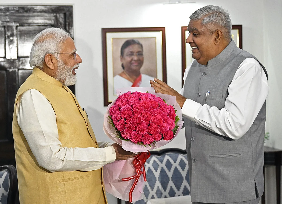 Prime Minister Narendra Modi congratulates Vice President-elect Jagdeep Dhankhar, at his residence, in New Delhi on Saturday.
