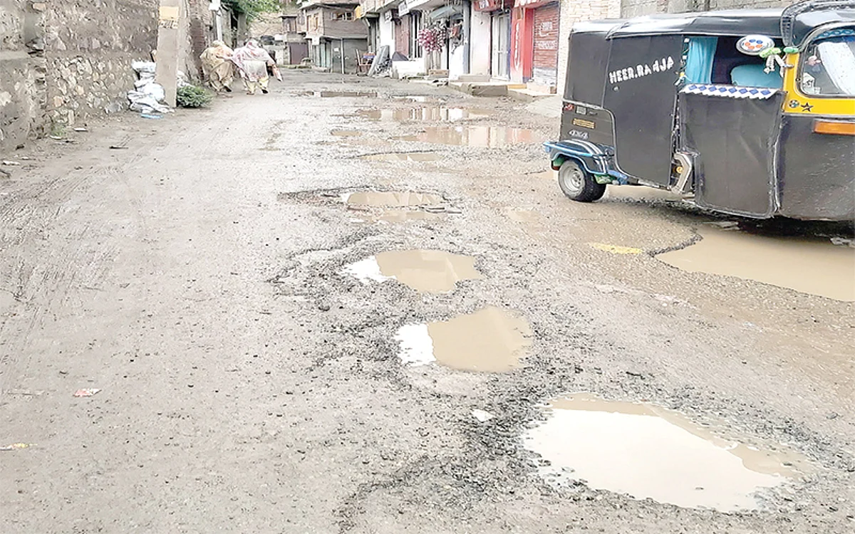Potholes dot at Bonamsar road