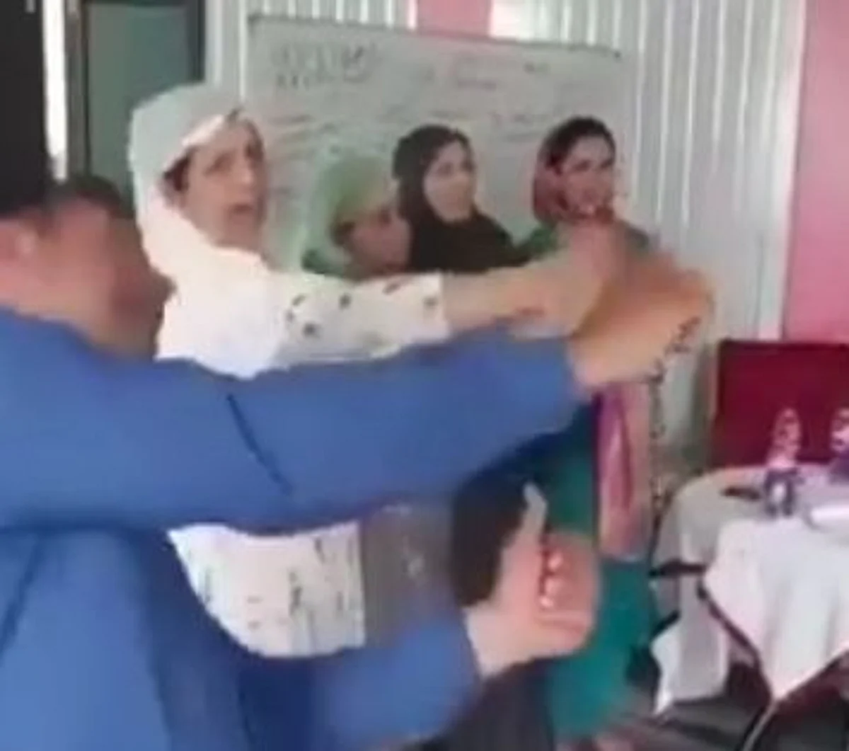 In a video clip with a group of teachers, Gulzar Ahmad Sheikh, Academic Officer, SCERT, can be seen singing and acting in the song "Peel Banana" training workshop.