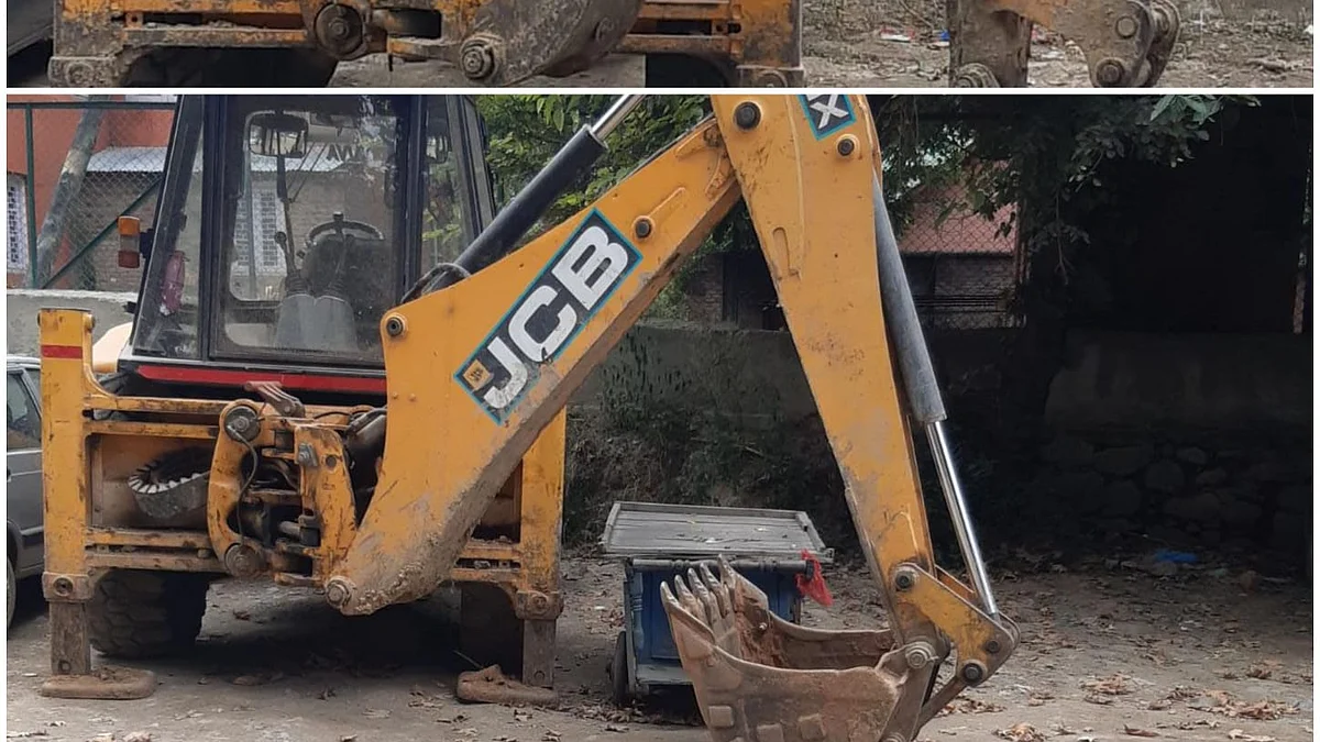 Seized earthmovers inside police compound