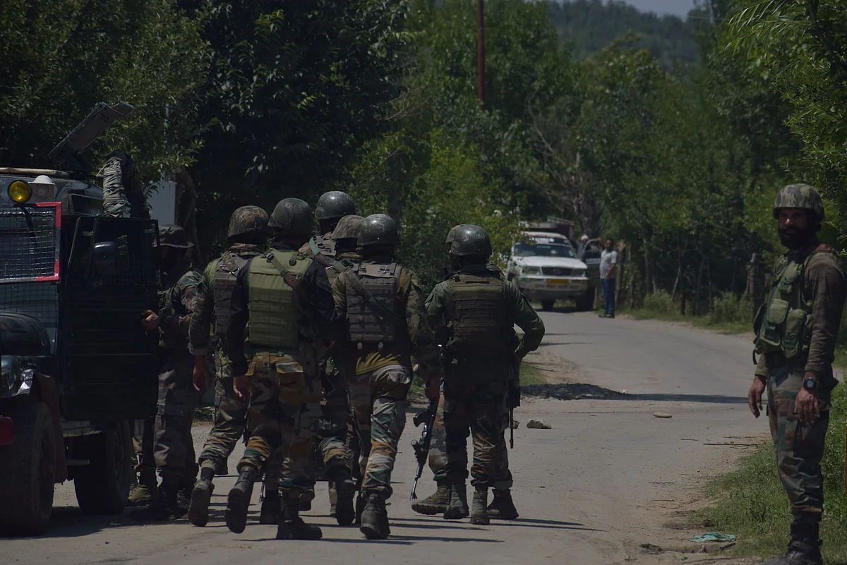 Security forces near an encounter site in Kashmir.