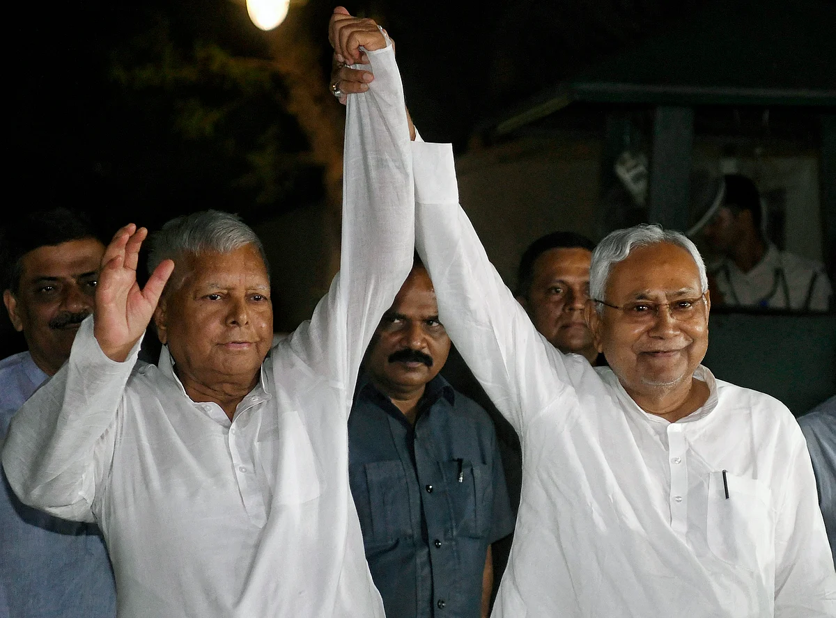 Bihar Chief Minister Nitish Kumar and Rashtriya Janata Dal (RJD) chief Lalu Prasad Yadav leave after meeting with Congress Interim President Sonia Gandhi, at her residence, in New Delhi on Sunday.