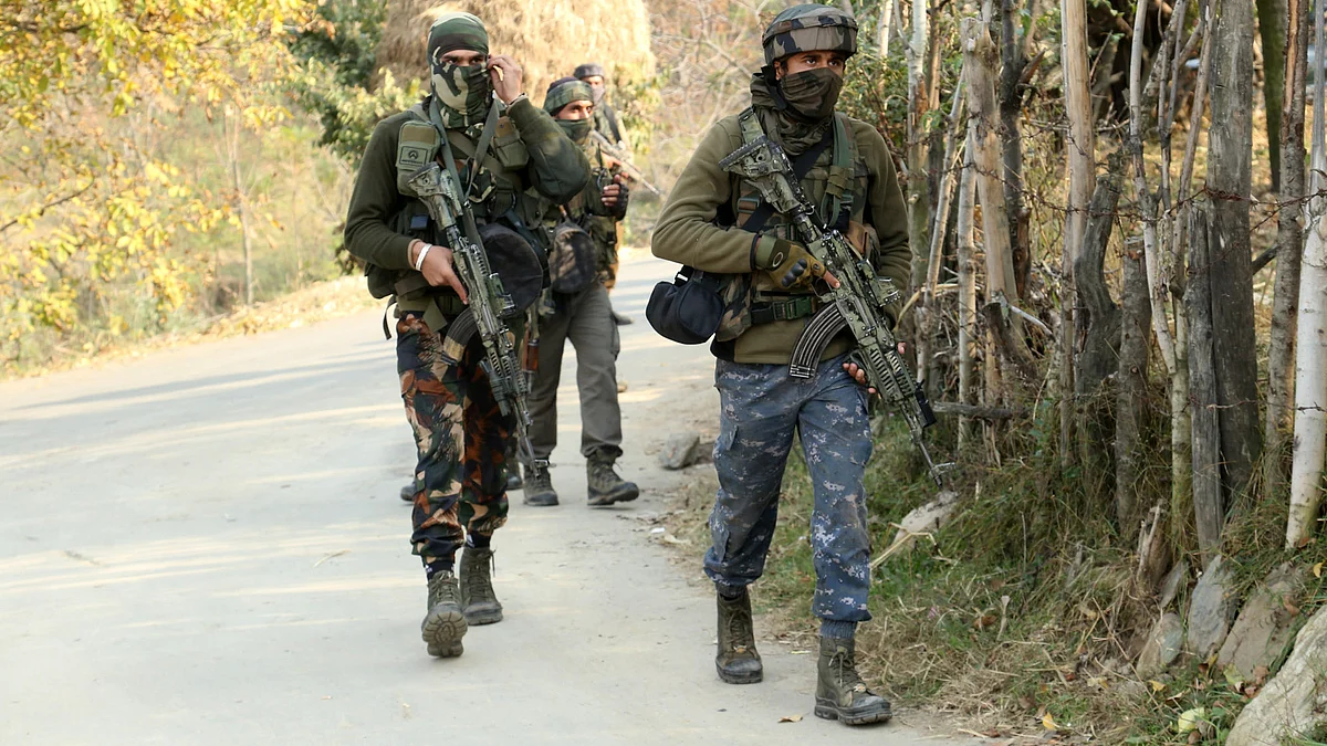 Army men near an encounter site in Sultanpora forest area of Sheeri Chandoosa in north Kashmir's Baramulla district on Wednesday October 26, 2022