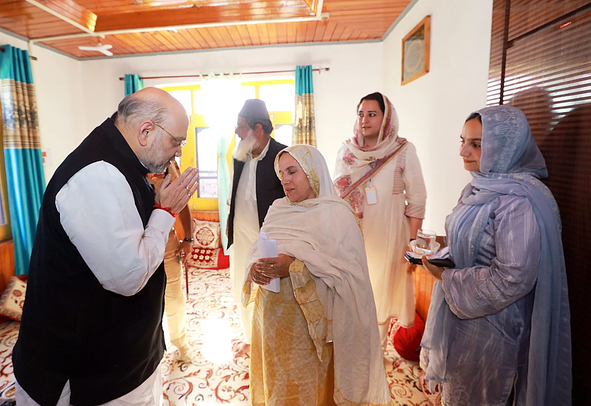 Union Home Minister Amit Shah meets the family of late SPO Mudassir Sheikh who lost his life while fighting 3 JeM terrorists at Najibhat crossing on 25th May in Baramulla, in Uri on Wednesday.