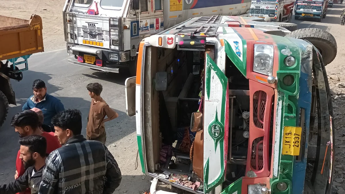 locals and rescuers said around 13 passengers were on board when it overturned on the road.
