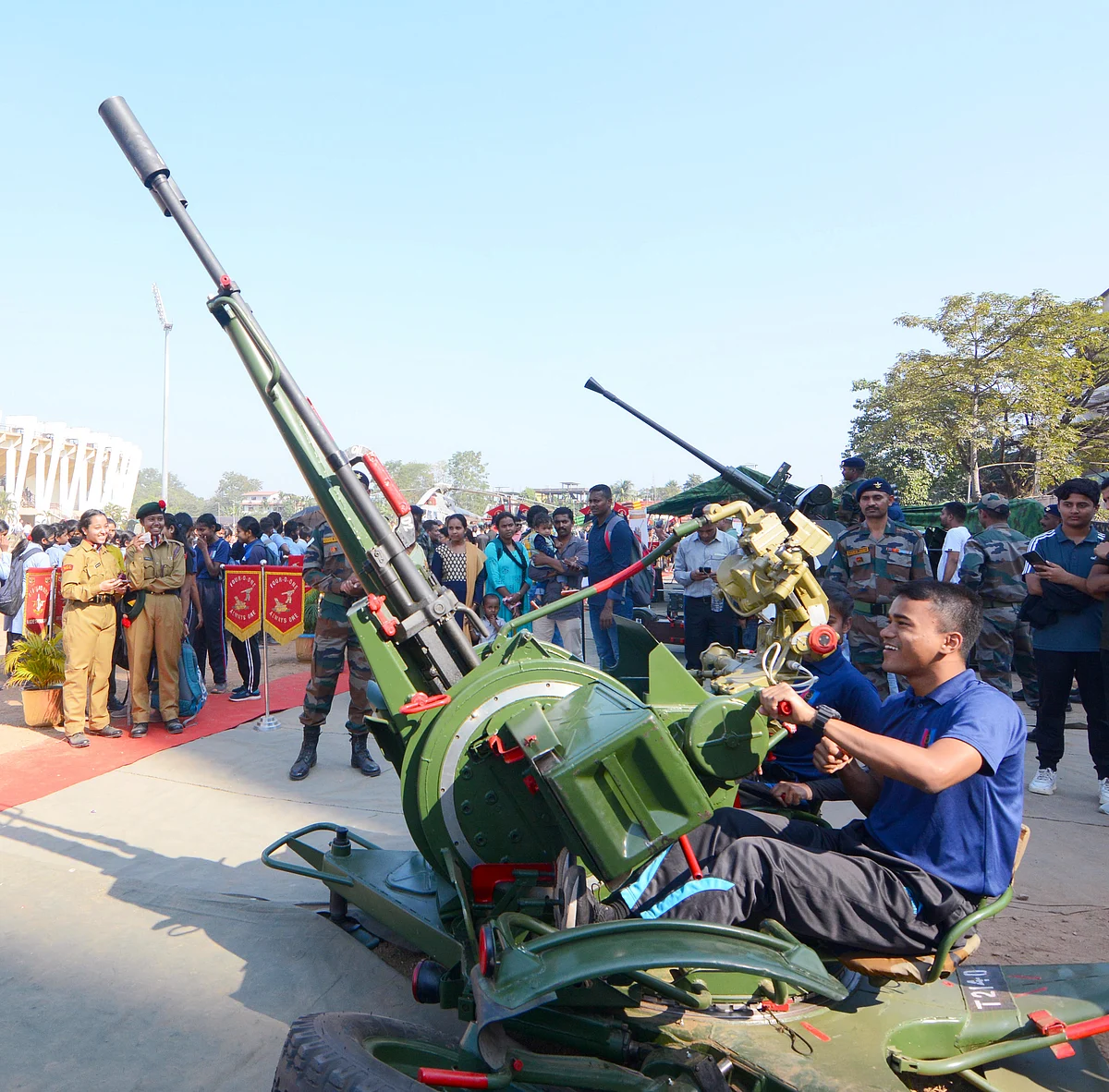 A student looks at the arms and ammunition displayed in an exhibition during Purvottar Swabhiman Utsav, at Sarusajai Stadium, in Guwahati on Monday.
