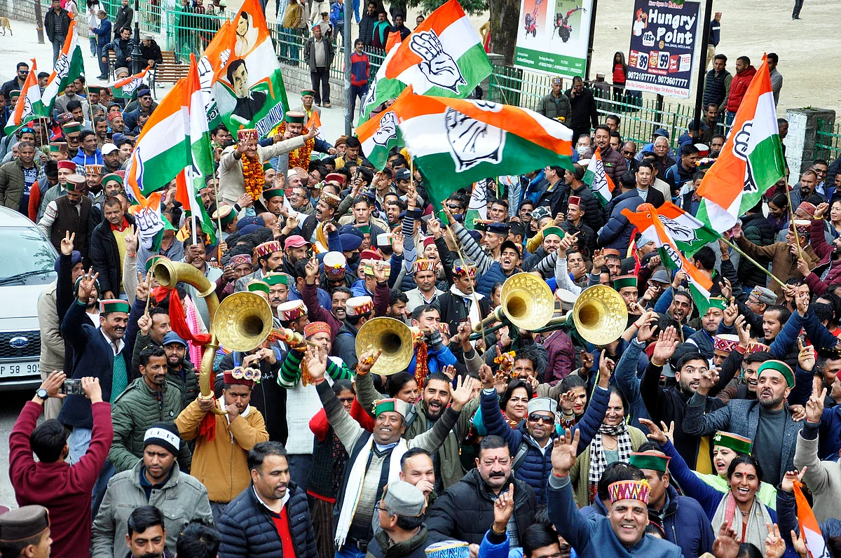 Congress supporters play musical instruments as they take out a rally to celebrate the party candidate Sundar Singh's victory in the Himachal Pradesh Assembly elections, in Kullu on Thursday.