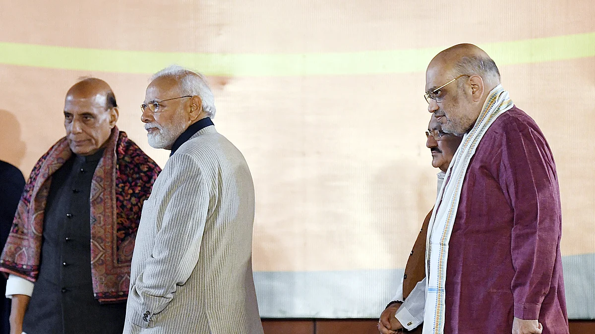 Prime Minister Narendra Modi greets BJP supporters in presence of party national president JP Nadda, Defence Minister Rajnath Singh, and Union Home Minister Amit Shah during a celebration after the party's victory in the Gujarat Assembly election, at party headquarters, in New Delhi on Thursday.