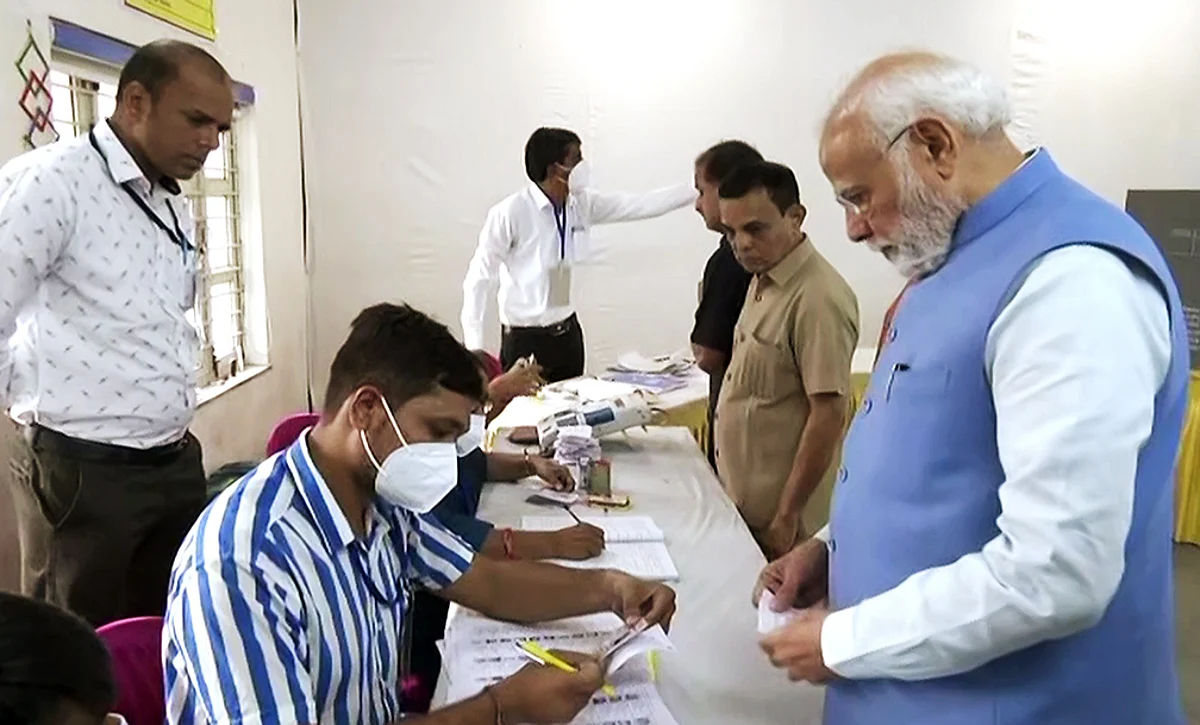 Prime Minister Narendra Modi goes through the election procedure to cast his vote for the second phase of the Gujarat Assembly elections, at Nishan Higher Secondary School, Ranip, in Ahmedabad on Monday.