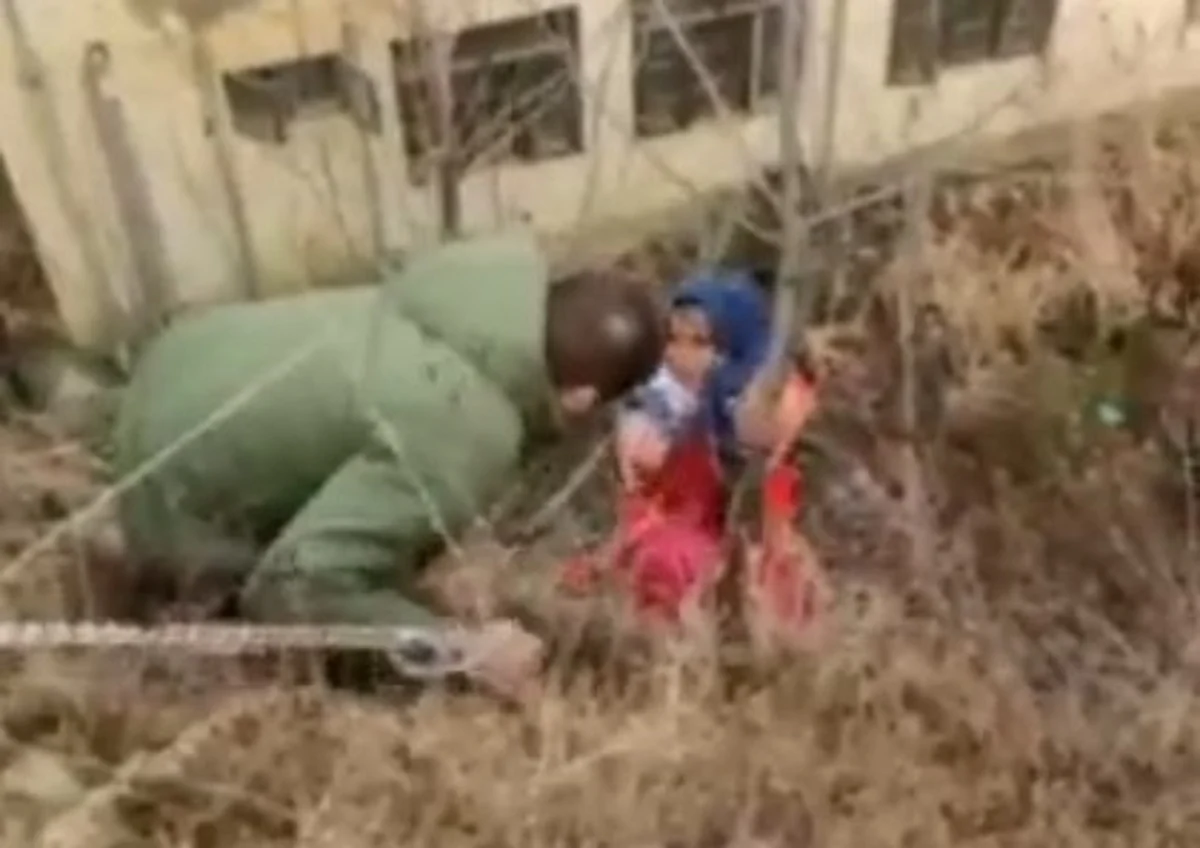 The woman was later pulled with a rope.