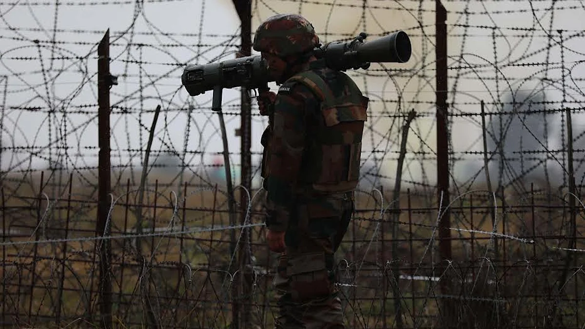 An army man patrols along the border in Jammu's Akhnoor ahead of R-Day and amid low visibility in the region.