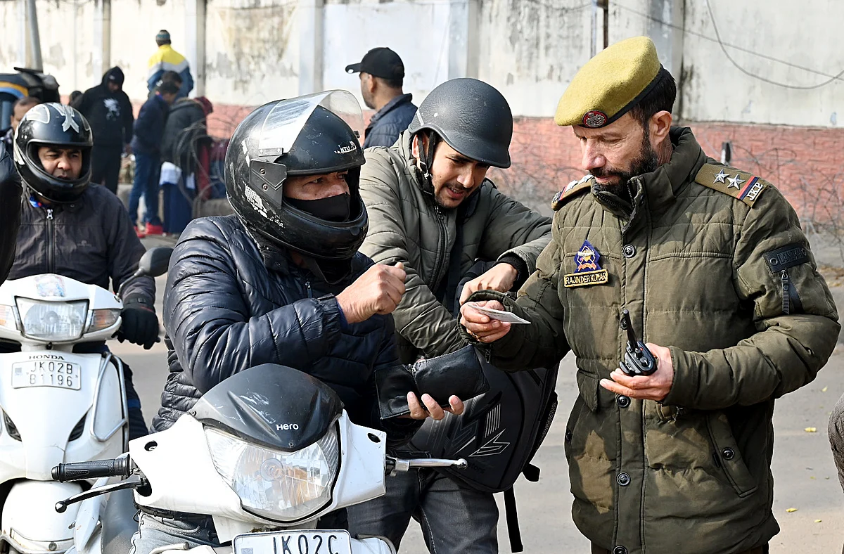 Jammu and Kashmir Police personnel conduct a security check after the recent terror attacks at Dhangri village of Jammu and Kashmir's Rajouri district, in Jammu