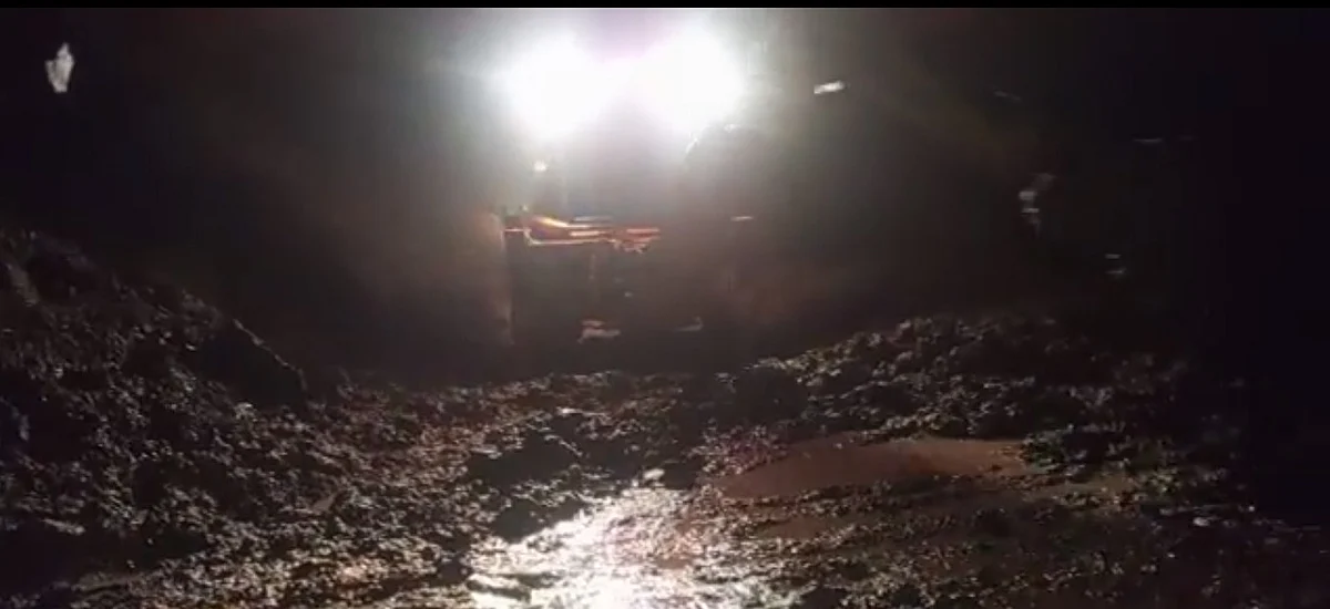 An earthmover removes rocks and mud as landslides blocked National Highway at various places along Ramban belt on Wednesday.