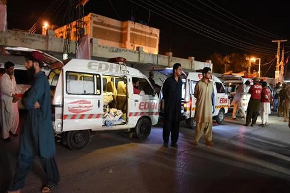 Families stage sit-in as death toll in Pakistan bus attack rises to 22