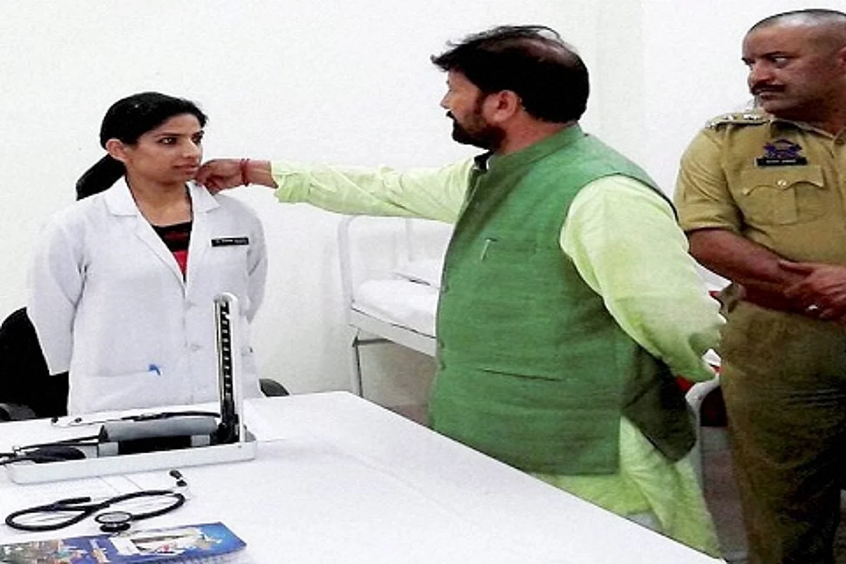 BJP Minister Chaudhary Lal Singh touches woman doctor’s collar, image goes viral