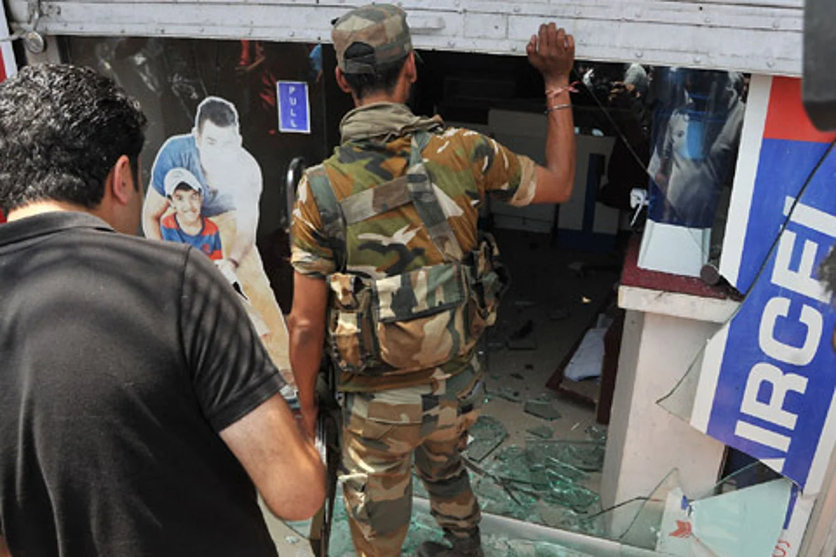 A cop inspects the site of a grenade attack in Srinagar. (Representative Image)