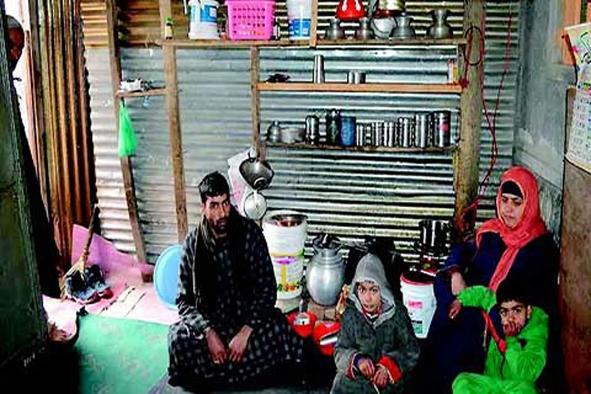 Shopian family spends sub-zero nights under tin shed