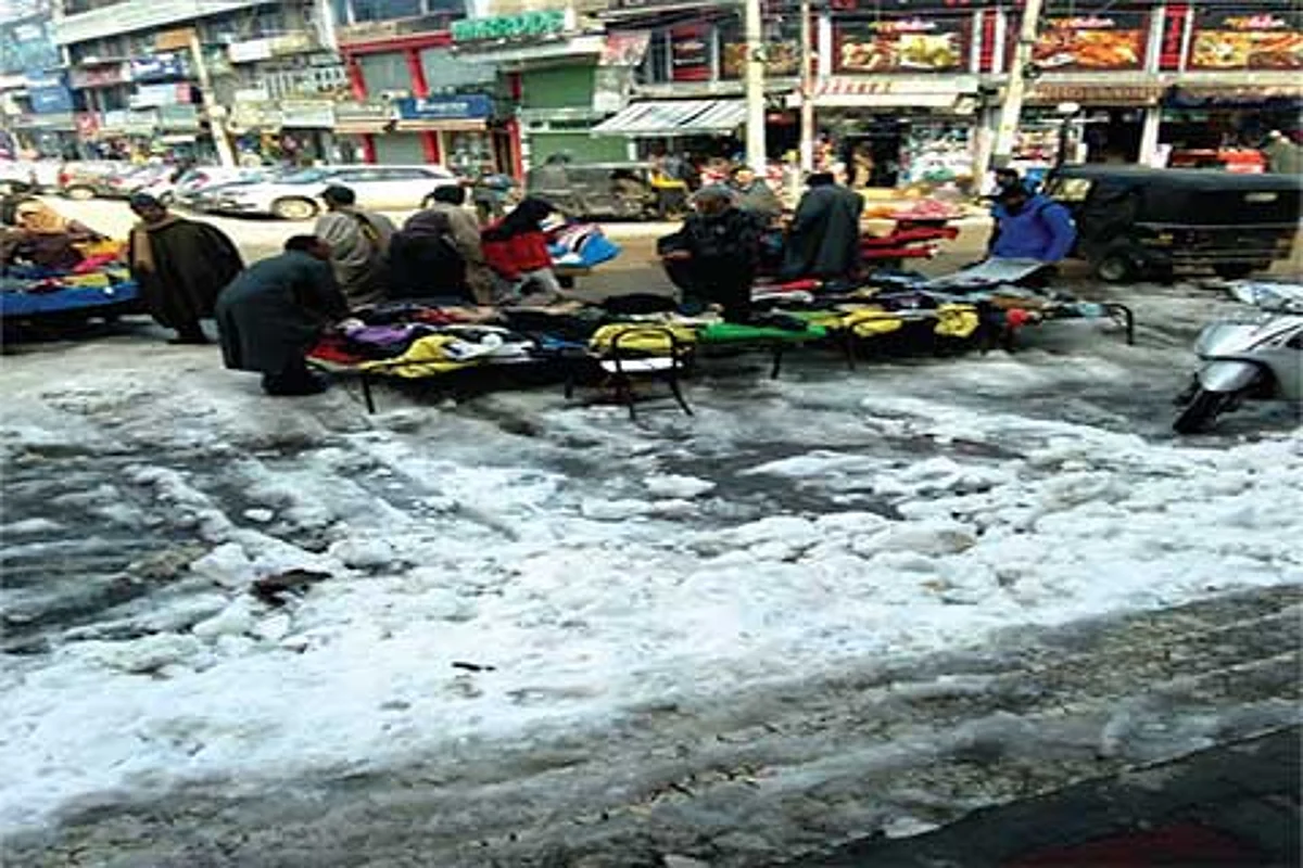 3 days on, city centre reels under snow mounds, water-logged roads