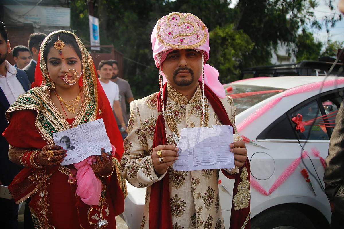 ‘Just Married’ couple reaches polling booth to vote in Udhampur in Jammu and Kashmir