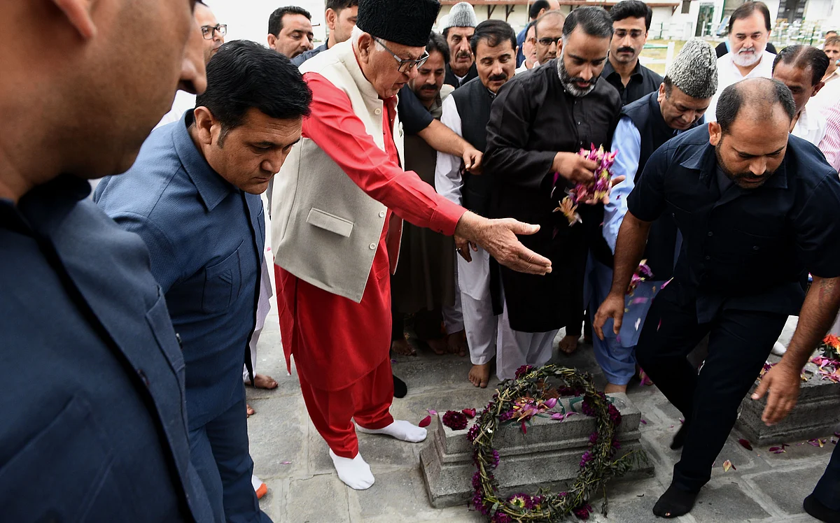 National Conference president Farooq Abdullah offers floral tribute to July 13, 1931 martyrs. Habib Naqash/GK