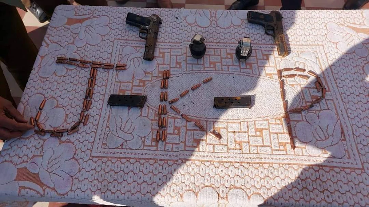 Two pistols, seventy bullets and two grenades were recovered.