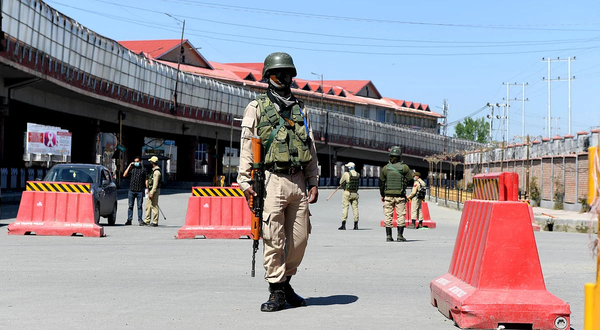 A security man stands guard near Jehangir Chowk area of Srinagar amid 'Corona Curfew' in the region.