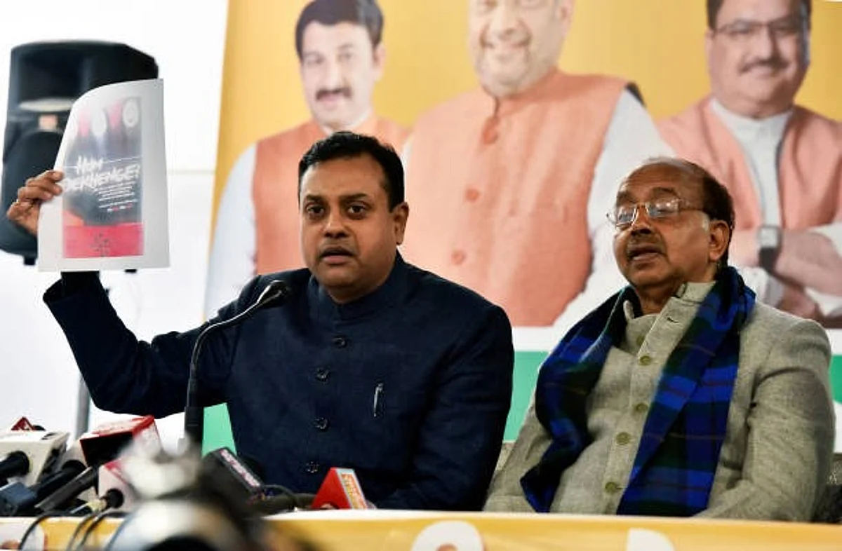 NEW DELHI, INDIA - JANUARY 23: Bharatiya Janata Party (BJP) Rajya Sabha MP Vijay Goel and BJP national spokesperson Sambit Patra address a press conference ahead of the Delhi Vidhan Sabha elections, at Pandit Pant Marg on January 23, 2020 in New Delhi, India. (Photo by Mohd Zakir/Hindustan Times via Getty Images)