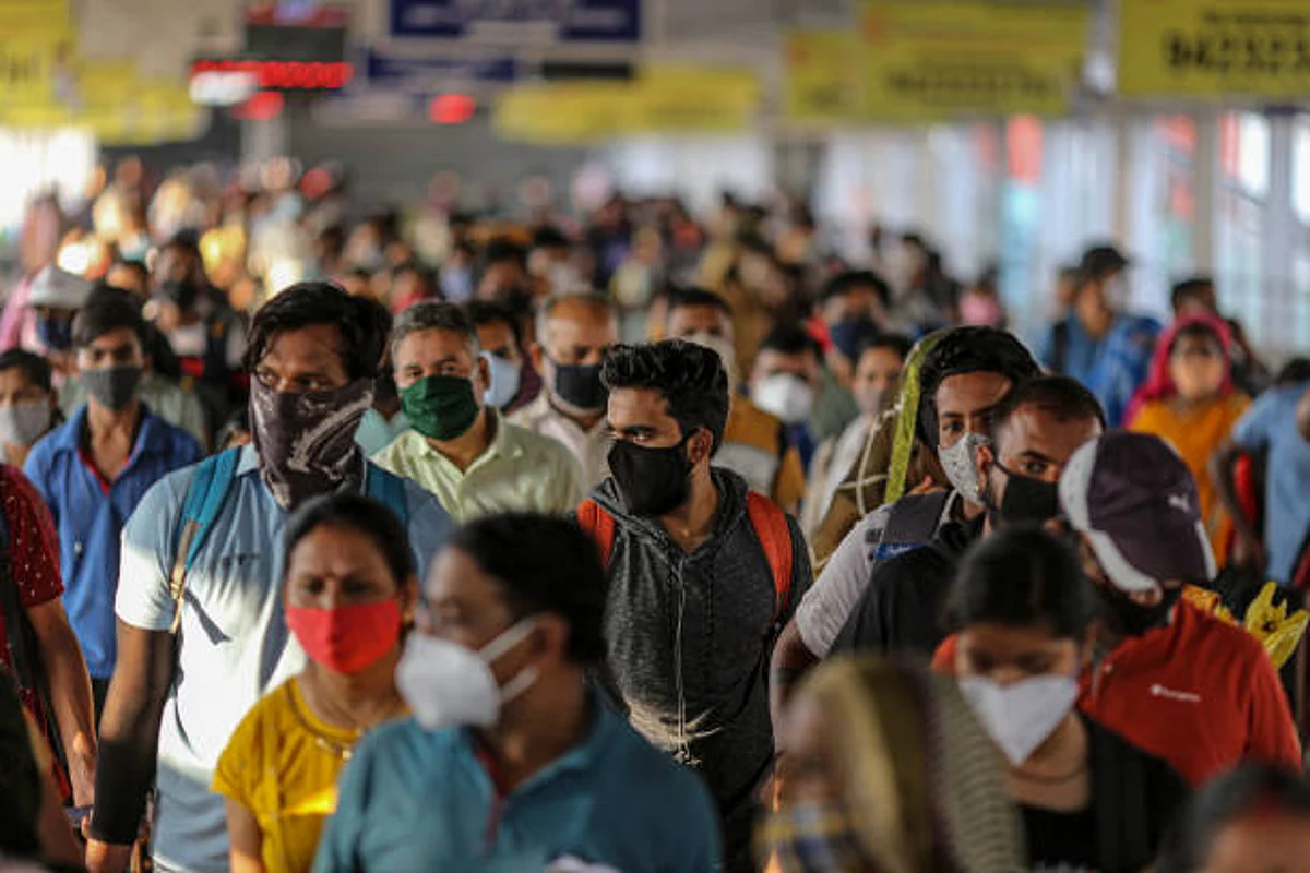 Passengers wait at a temperature checkpoint after arriving at Pune railway station during lockdown restrictions imposed by the state government in Pune, Maharashtra, India, on Thursday, May 6, 2021. Serum, the worlds largest vaccine maker based in Pune, will deliver 220 million doses to Indias vaccine-starved federal and state governments over the next few months, which can cover 8% of the country's population. Photographer: Dhiraj Singh/Bloomberg via Getty Images