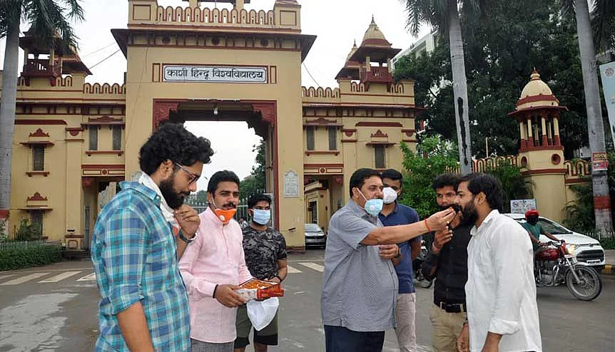 BHU professors and students celebrate after the government approved new National Education Policy. Many politicians in the past have felt that allowing foreign universities to open campuses in India would raise the cost of higher education.