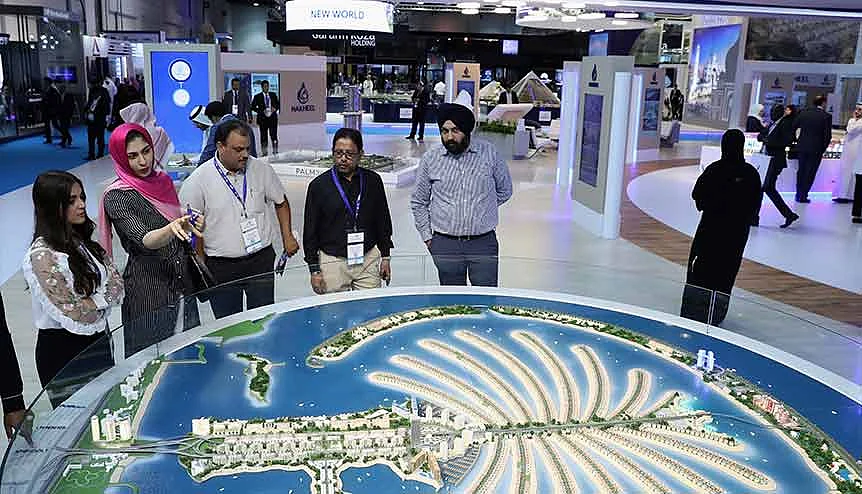 Visitors look at a scale model of Palm Jumeirah during Cityscape Global at Dubai World Trade Centre. Indian Investors are leading the way in purchases in Dubai real estate sector even during the pandemic.