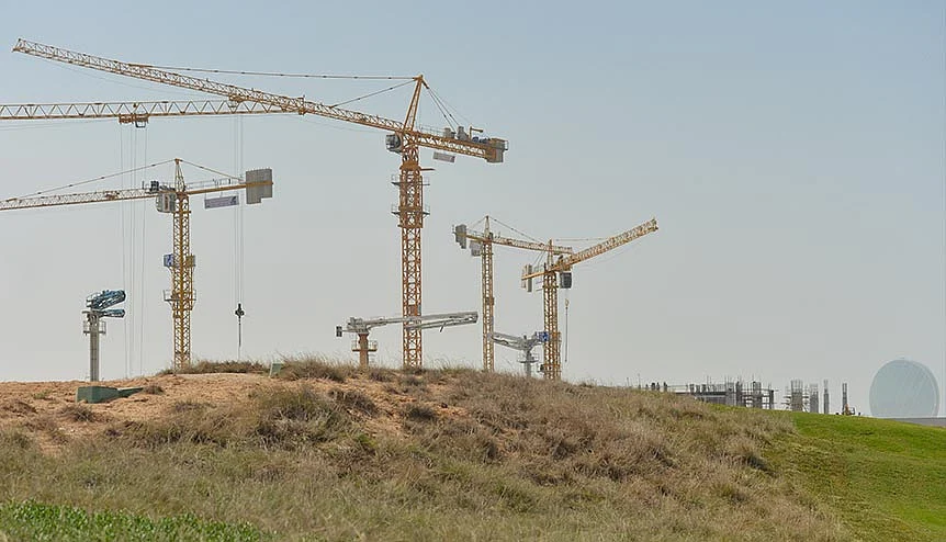 A construction site in the UAE. Dip in oil prices has made property rates slip further, resulting in an atmosphere where investors are taking advantage of a captive demand for mid-market and residential options.