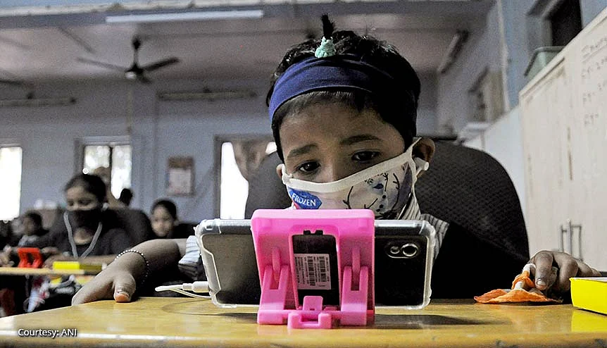 Students studying using smartphones at a mobile library inaugurated at Imamwada in Mumbai. The wide spread penetration of smartphones and data is fuelling digital consumption in India whether it is online shopping, gaming or even learning.