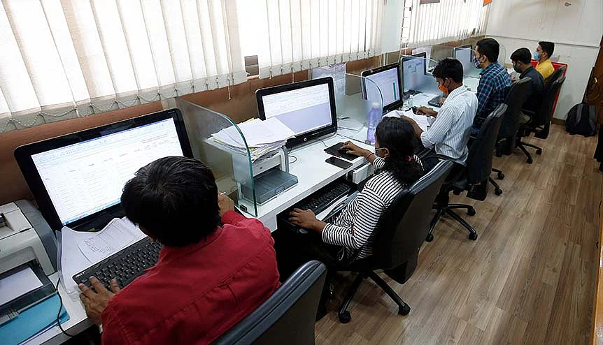 Government officials working on their computers at a data entry centre. India is already well on its way to having data privacy norms that are compliant with global norms.