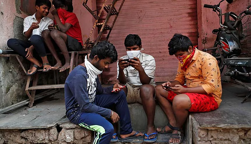 A group of boys working their mobile phones during India’s nationwide lockdown. The proposed Indian data privacy law, pending since 2019, once enacted, will completely overhaul the country’s data privacy regime.