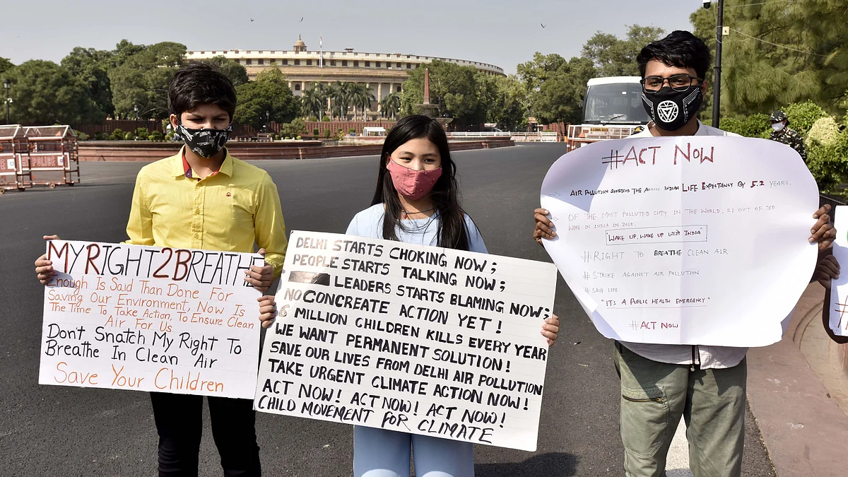 Licypriya Kangujam (C), a 9-year-old climate activist, stages a protest against air pollution in New Delhi. The UK university and its Indian partners also plan to support the development of education programmes that will help produce future transport leaders and world-leading research.