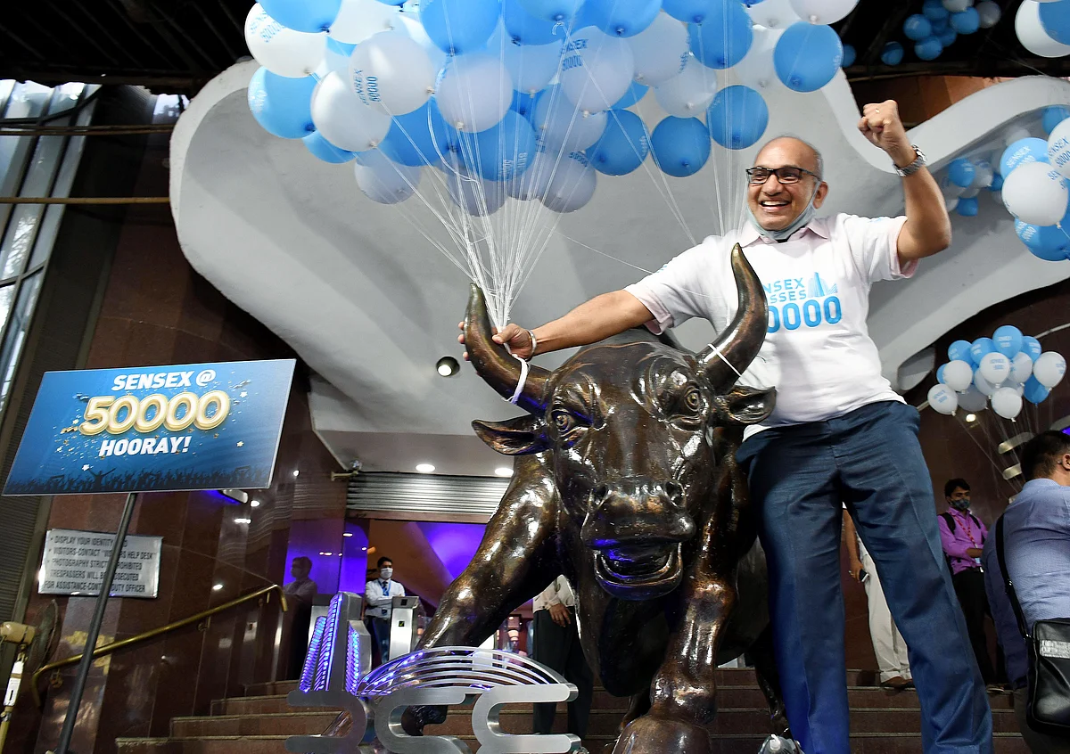 An investor poses outside the BSE. Equity returns outstrip all other asset classes by a fair margin. Yet, Indian retail investors have traditionally been shy of investing in stocks.