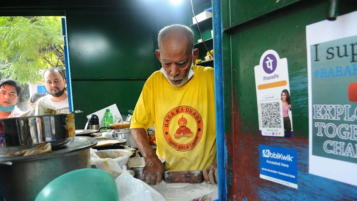 80-year-old Kanta Prasad and his wife Badami Devi, co-owners of Baba Ka Dhaba, work at their eatery, in Malviya Nagar, Delhi. The couple, who had been losing their livelihood due to the coronavirus (COVID-19) pandemic. India has a low insurance penetration of 3.76 per cent I 2019 as compared to other nations.