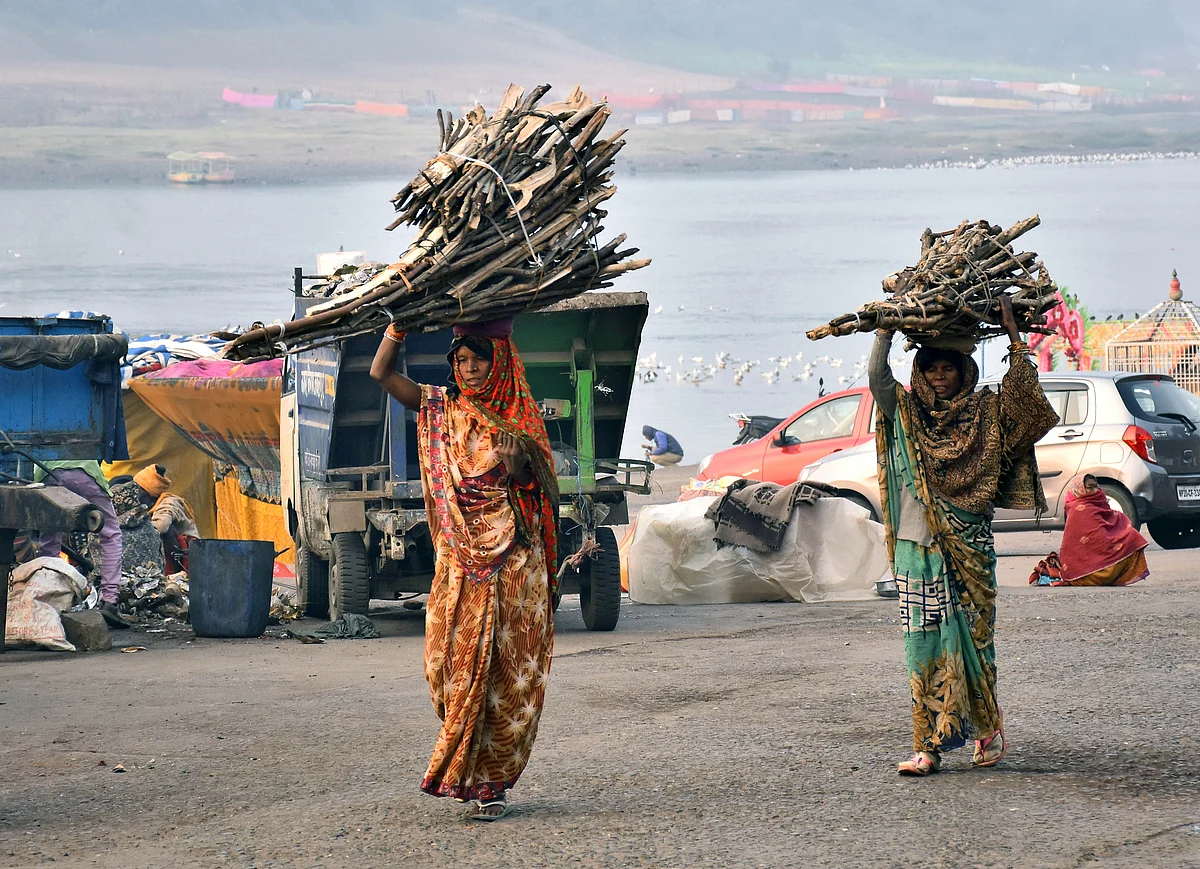 Rural women carrying wooden sticks on their heads. Clear readings are still not emerging from the country’s rural areas where infections are spreading rapidly.